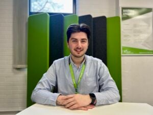 Young man sat at a desk