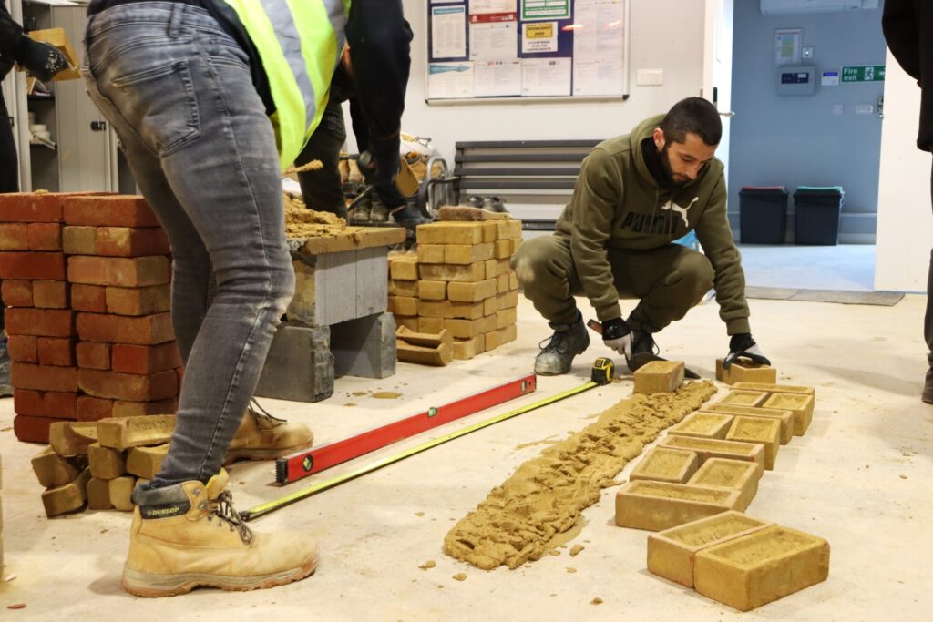 bricklaying student learns in a workshop