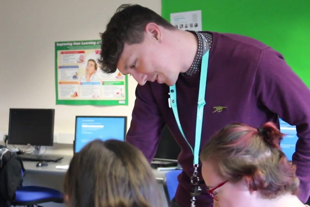 Kurt helping his students in the classroom
