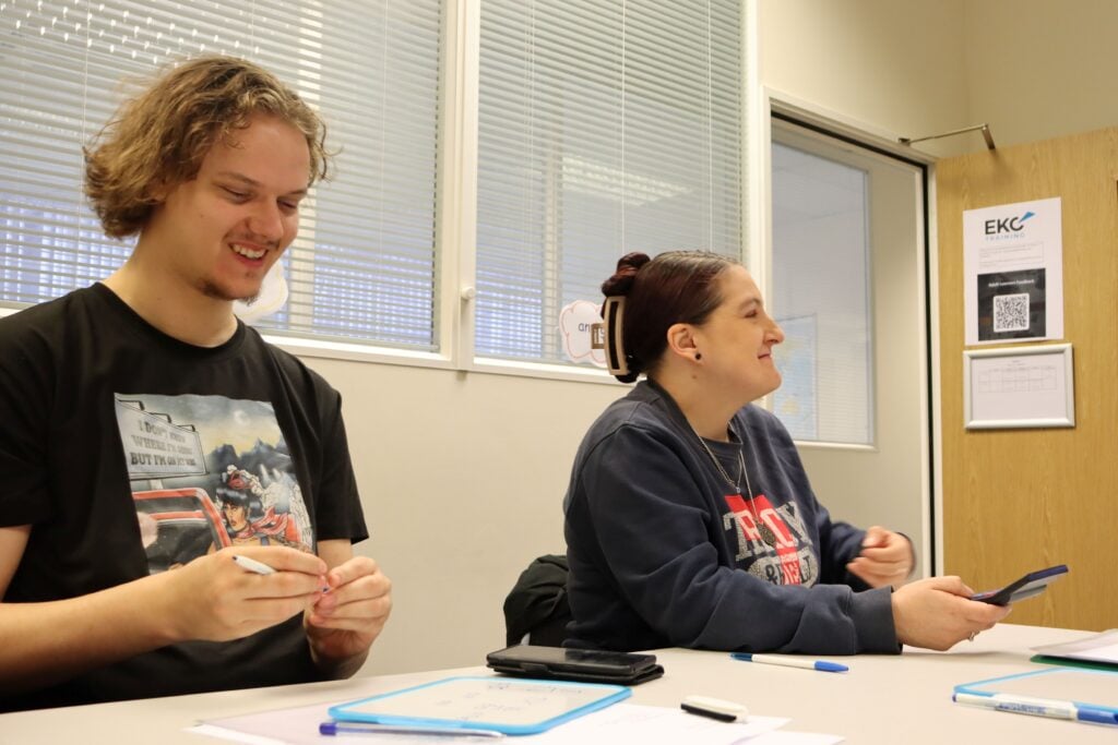 two adult learners in maths classroom