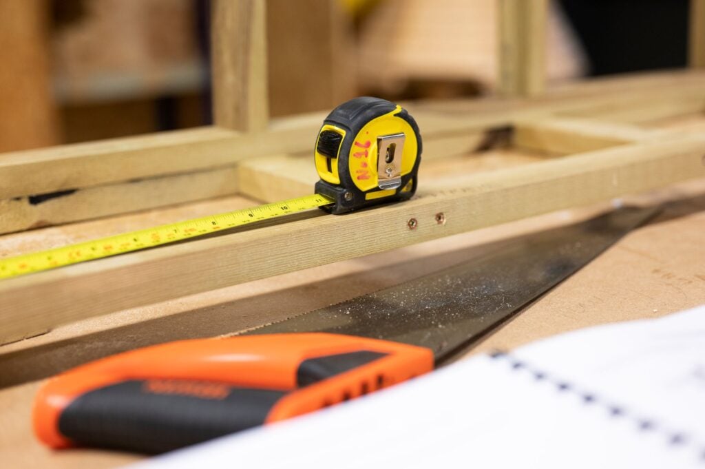 Measuring tape and saw