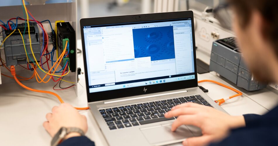 Engineering student working on a laptop