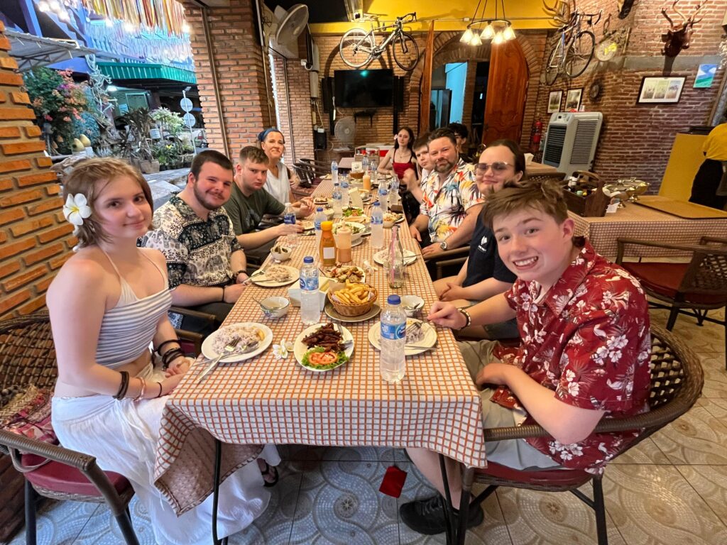 students eat together in Thailand