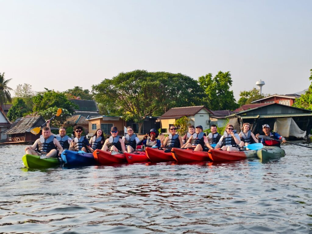students kayak in Thailand