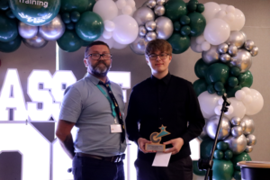 Student collecting award