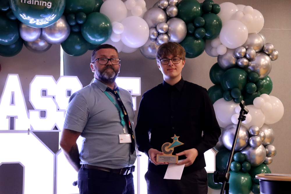 Student collecting award