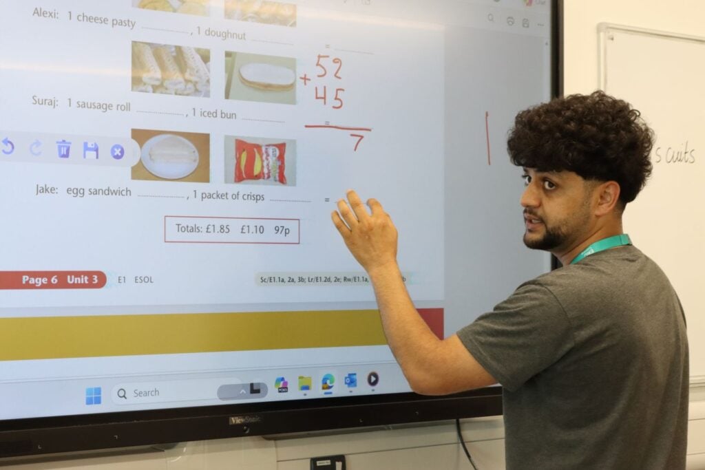 ESOL student uses interactive board at EKC Training Dover Centre