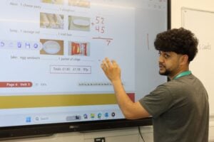 ESOL student uses interactive board at EKC Training Dover Centre