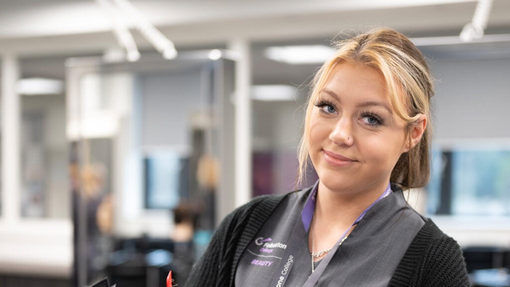 Beauty student smiling looking at the camera.