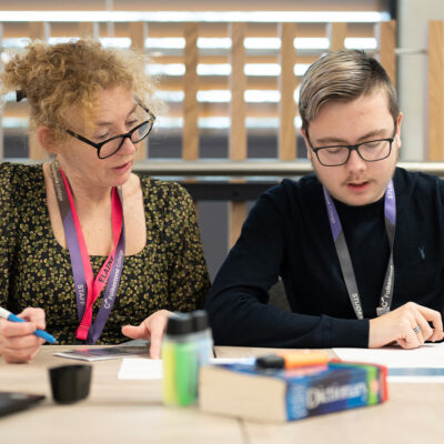 Staff helping student in the LRC