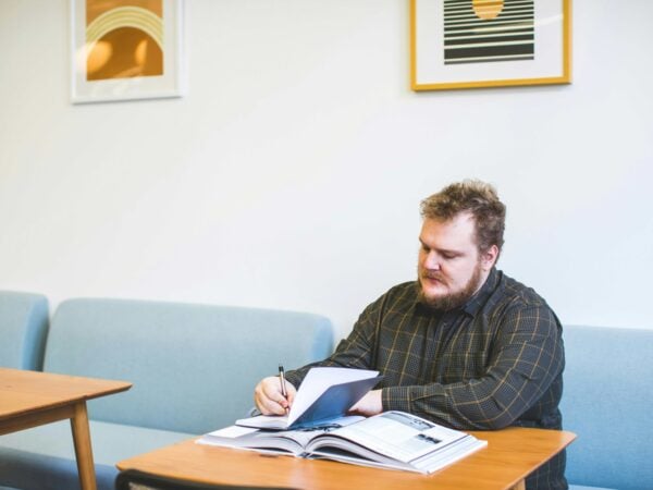 Adult learner sat working with a textbook