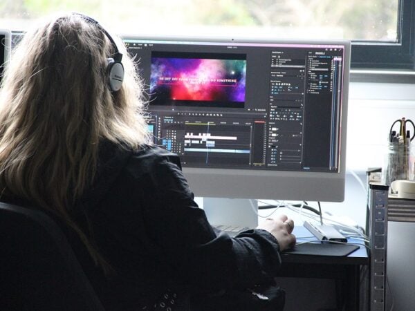 Student editing videos on the computer as part of the KFE Skills Competition