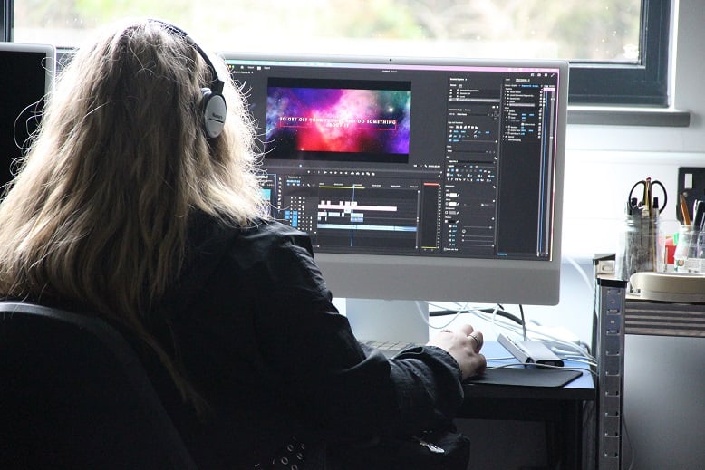 Student editing videos on the computer as part of the KFE Skills Competition