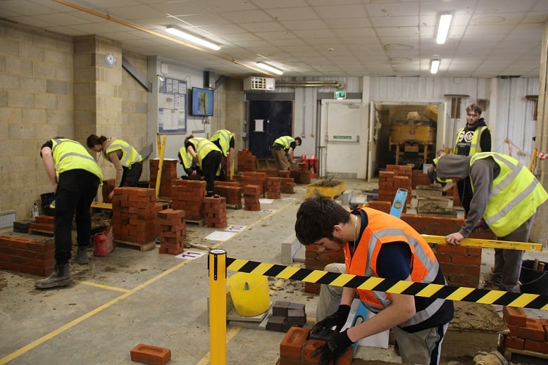 Brick students building walls as part of the KFE Skills Competition