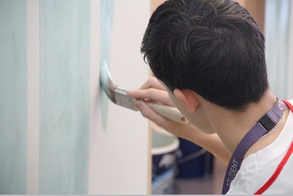 Student painting stripes as part of the KFE Skills Competition