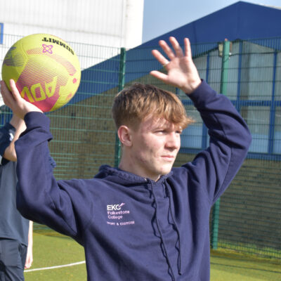 Sport student throwing a netball