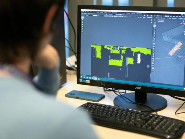Student using computer software for game development.