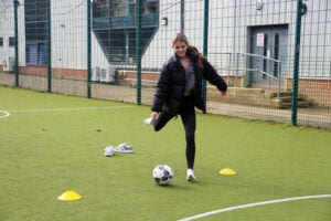 Student about to kick a football