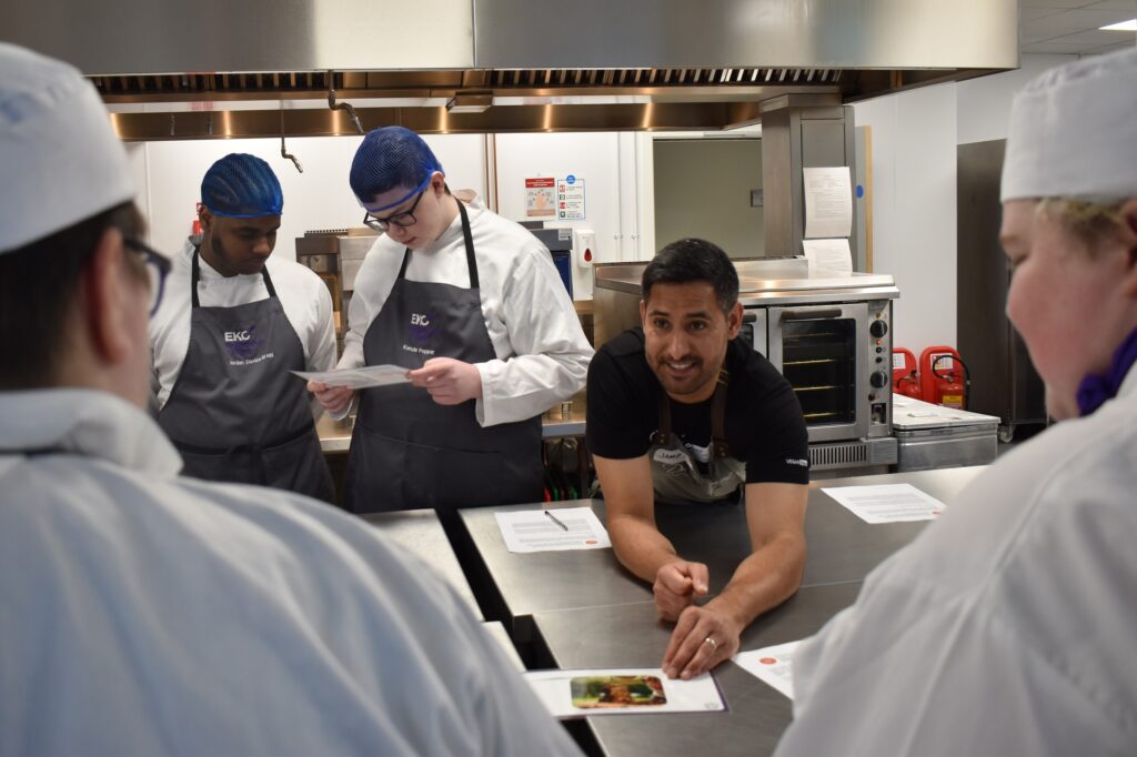 Mauro of Made in Hackney speaks to College students in a kitchen