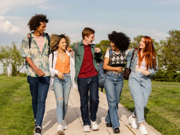 Students walking to College, chatting and happy