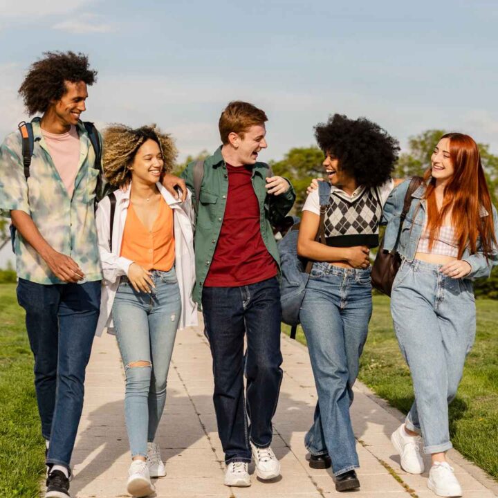 Students walking to College, chatting and happy