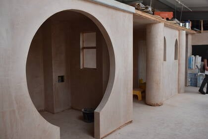 Plastering walls in the Construction workshop.