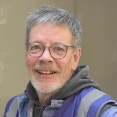 Adult plasterer student smiling at camera