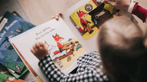 child reading children's book