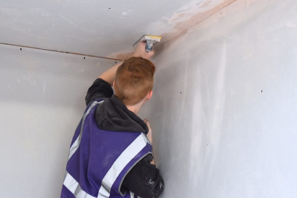 Plastering student at EKC Folkestone Colleg
