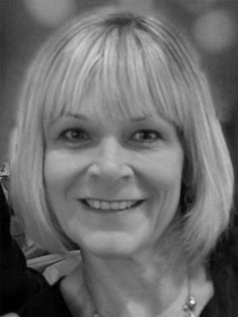 Black and white photo of a lady smiling