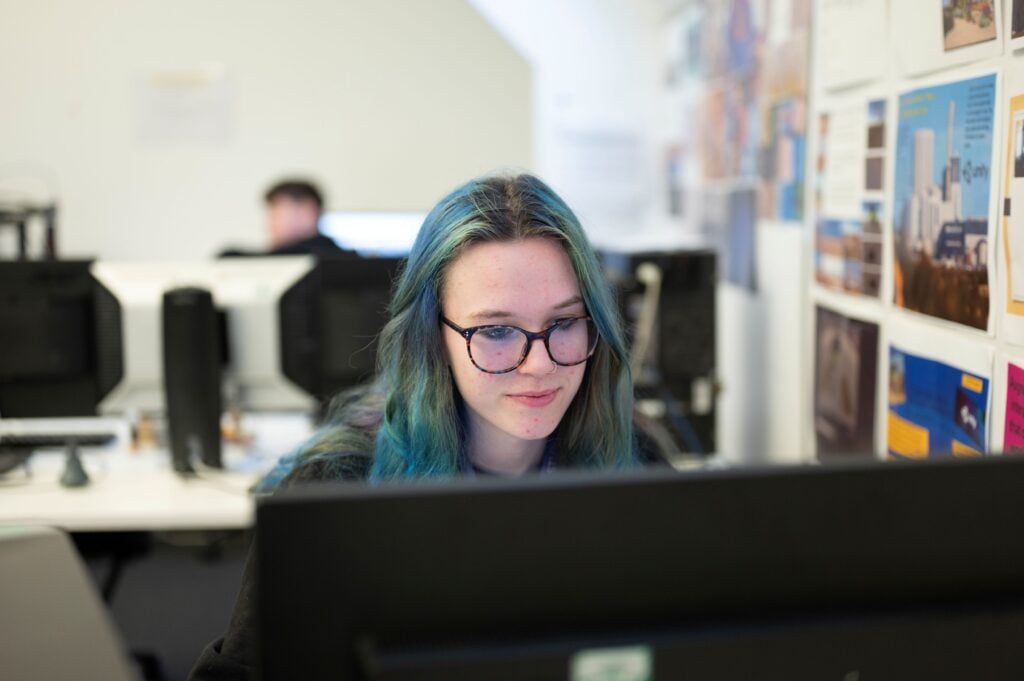 female student looking at computer