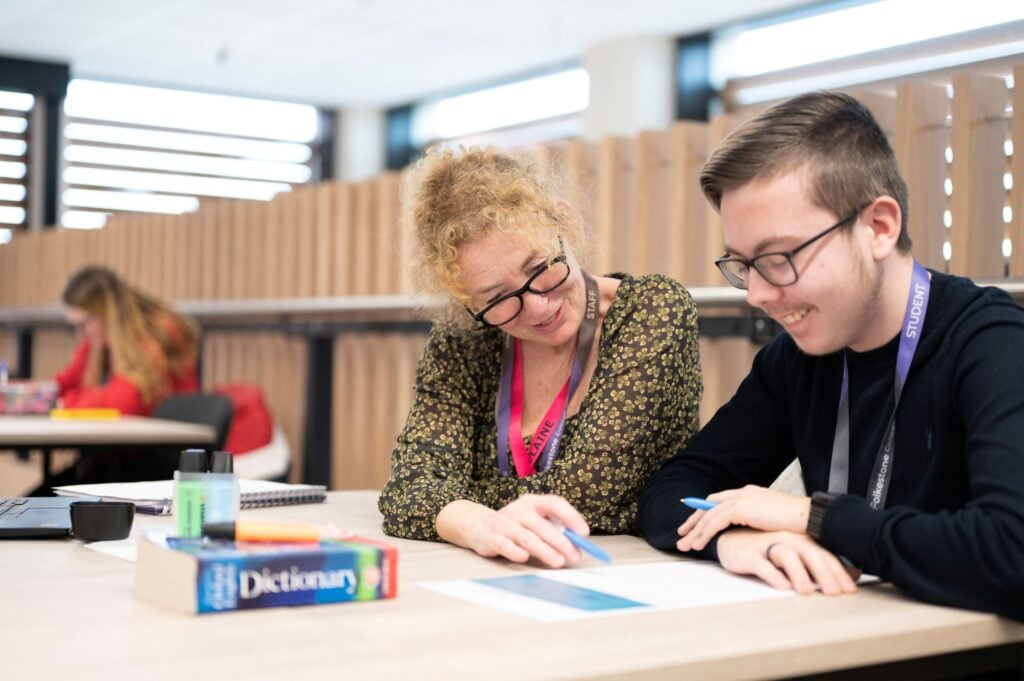a student with lecturer at college