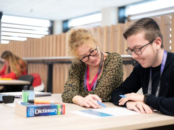 a student with lecturer at college