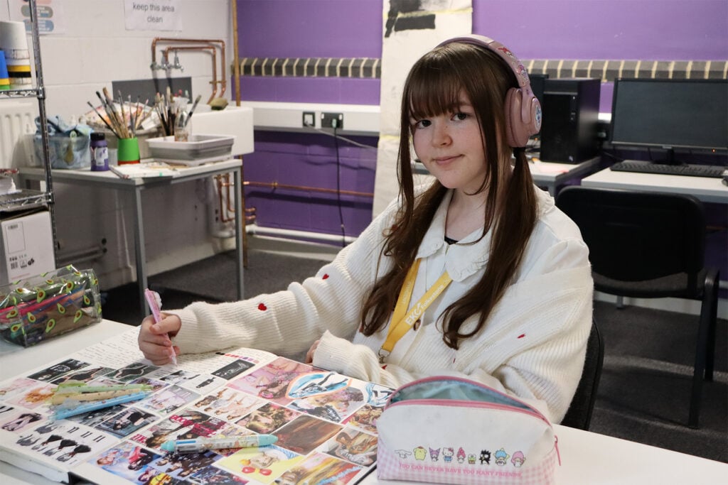 a junior college student works on a project