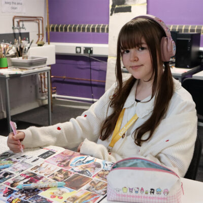 a junior college student works on a project
