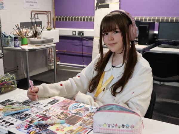 a junior college student works on a project