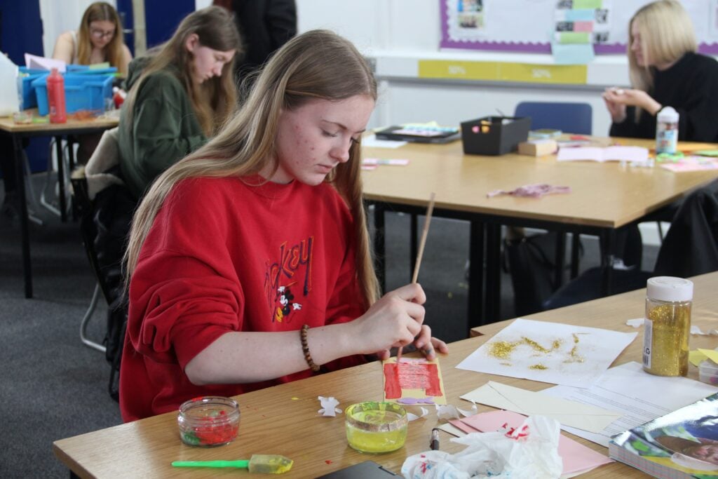 student sat painting