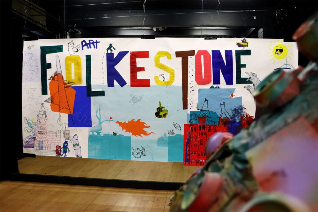 Art work on display in a exhibition - you can see 'Folkestone' on bold colourful letters