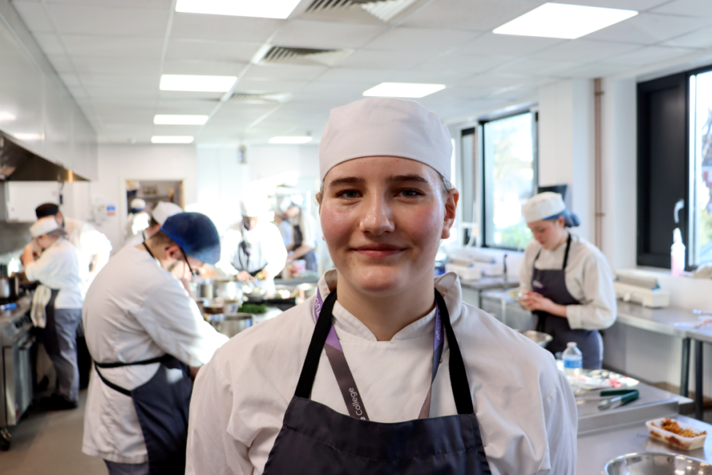 Headshot of female chef in kitchen