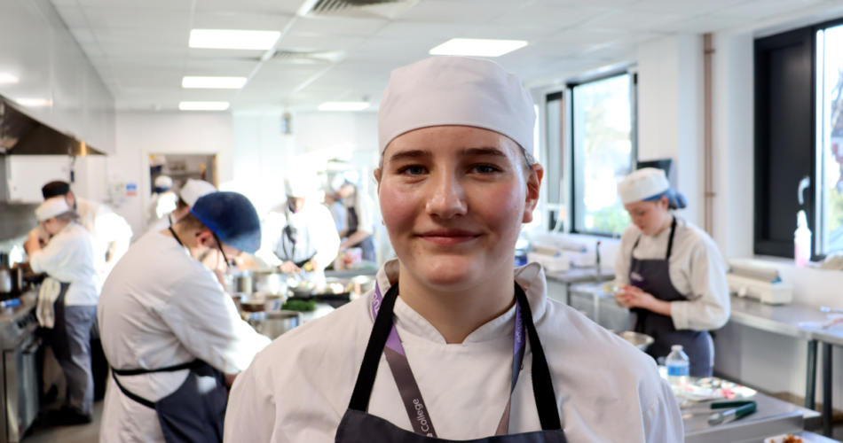 Headshot of female chef in kitchen