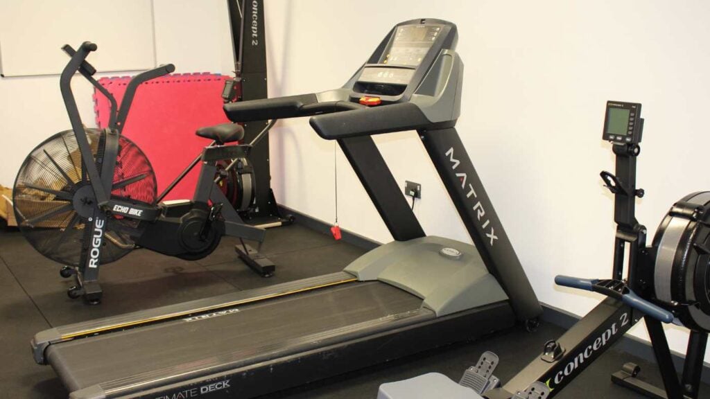 Treadmill machine in the middle of the gym.