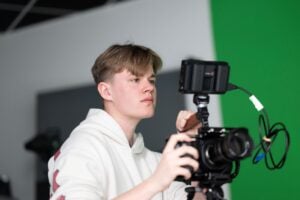 Male student using a camera